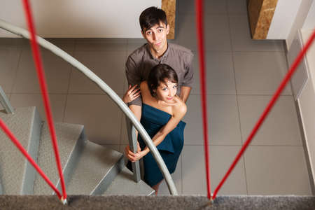 Young couple flirting in officeの写真素材