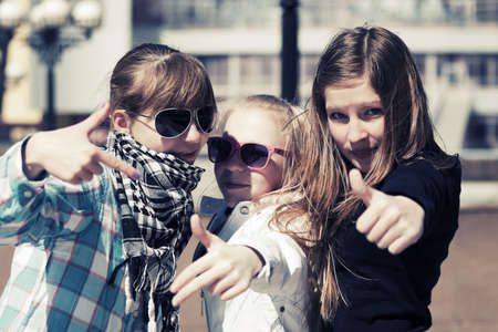 Group of happy teen girls on the city streetの写真素材