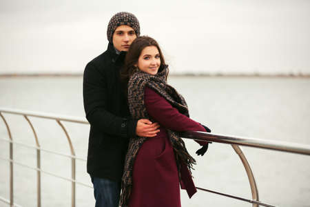 Happy young couple in love walking outdoorの写真素材