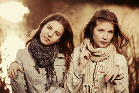 Two young fashion girls on natureの写真素材