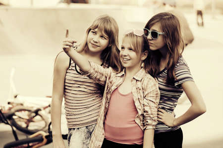 Group of happy teen girls on the playgroundの写真素材