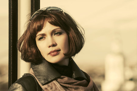 Sad beautiful fashion woman on city streetの写真素材