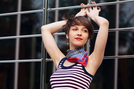 Happy young fashion woman walking outdoorの写真素材