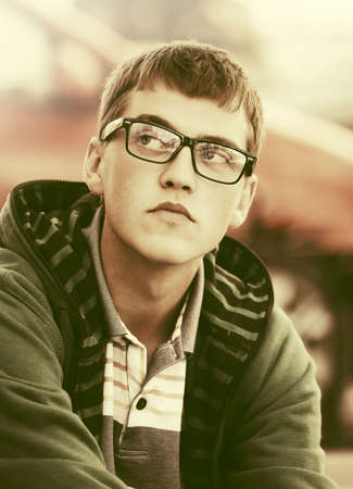 Sad young fashion man on city streetの写真素材