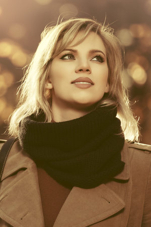 Happy young blond fashion woman walking outdoor