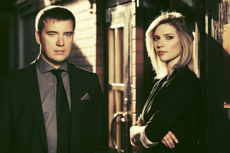 Young fashion business couple at office building