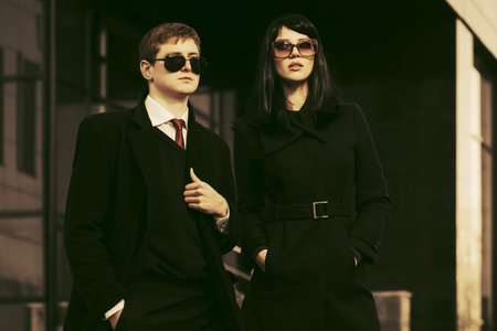 Young fashion business man and woman at office buildingの写真素材