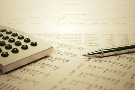Financial accounting Pen and calculator on balance sheetsの写真素材