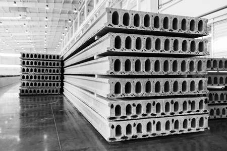 Stack of precast reinforced concrete slabs in a house-building factory workshopの写真素材