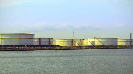 oil storage tanks in refinery plant with sea sky  backgroundのeditorial素材