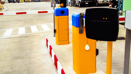 black gard reder mechine with barrier of car parkingの写真素材