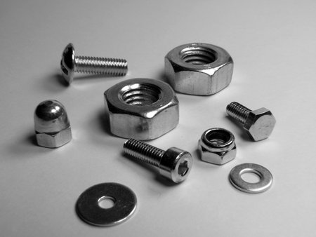 Spilled screws and nut - close