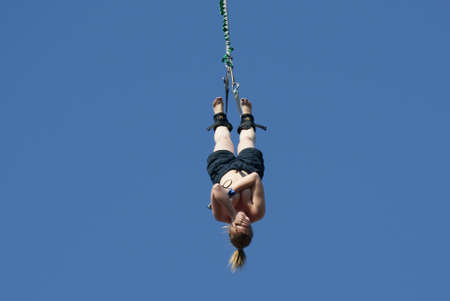Bungee, woman jumps without little shirt  Toples の写真素材