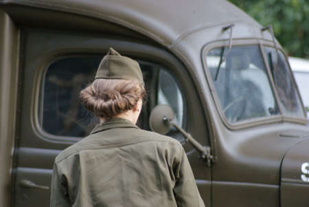 The woman the Soldier of USA on background of lorry のeditorial素材