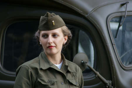 The woman the Soldier of USA on background of lorry のeditorial素材