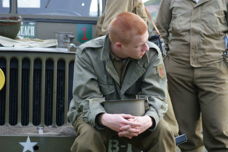 Of USA sitting on bumper of Jeep soldier のeditorial素材