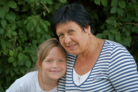 8 year old granddaughter a hug to her grandmother