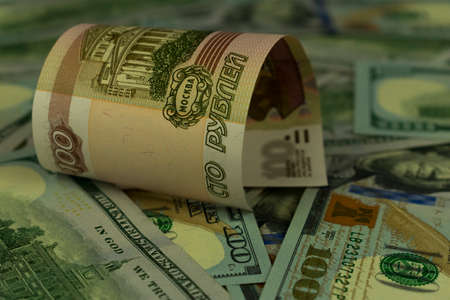 background image of US dollars and one hundred Russian rublesの写真素材