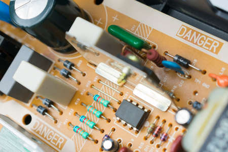 board with radio components - transitor, diode, capacitor, microcircuit, transformer, coil inside the VCRの写真素材