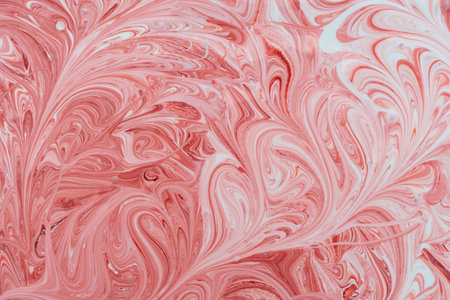 mixing white acrylic paints on a water basis, with a red color in a jar of paint