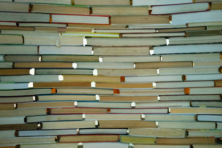 the book laid out a wall as the backgroundの写真素材