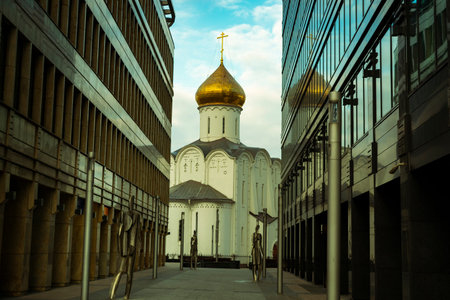 old orthodox church in moscow between modern skyscrapers in moscow, perspective view