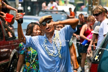Chiang Mai, Thailand - April 13, 2010 - Thai old man gets fun on April 13, 2010 in Chiang Mai, Thailand. Celebration of Thai New Year (Songkran water festival) in 2010. のeditorial素材