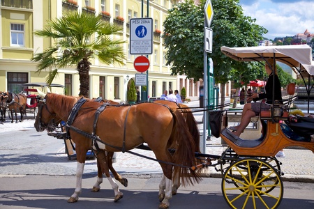 Karlovy Vary, Czech Republic, July 19, 2011 - Tourists horse carriage on a street in Karlovy Vary.のeditorial素材