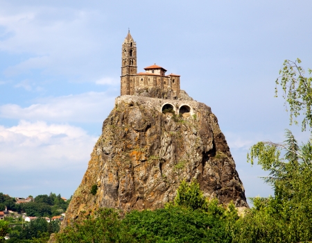 Ancient Chapelle Saint Michel de Aiguilhe standing at a very steep volcanic needle (Le Puy en Velay, France)の写真素材