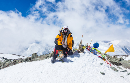 Mountain climber at the top of Lenin Peak, Pamir Mountains, Kyrgyzstanのeditorial素材