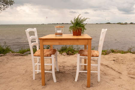 A romantic table on the sandy beachの写真素材