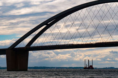 Detailed photo of the silhouette of the arch of the Fehmarnsund Bridge, Baltic Sea, Germany, island Fehmarnの写真素材