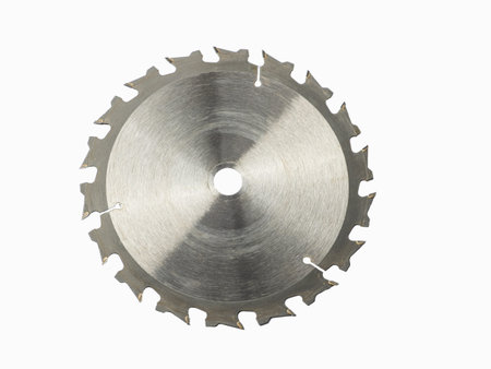 A circular saw blade cropped against white background. close up