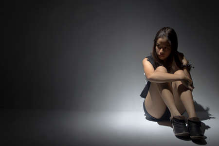 lonely asian teenagerの写真素材