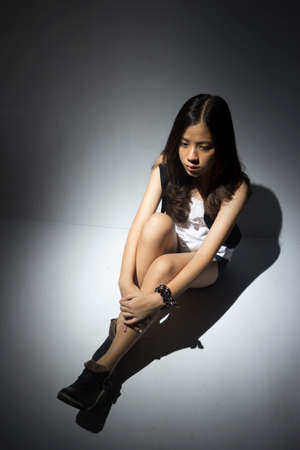 lonely asian teenagerの写真素材