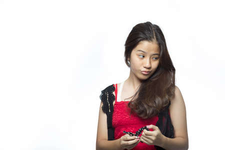 Asian teen girl with red dressの写真素材