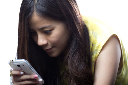 Asian teen girl with her smartphoneの写真素材
