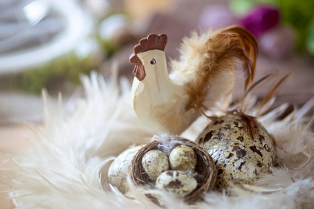 easter table with decoration, rooster and eggs