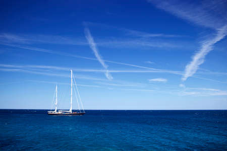 Sailing yacht in the blue seaの写真素材