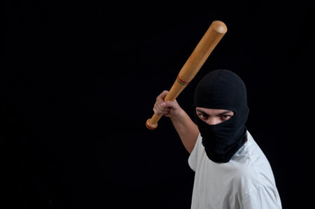 Young holigan provocate with baseball bat