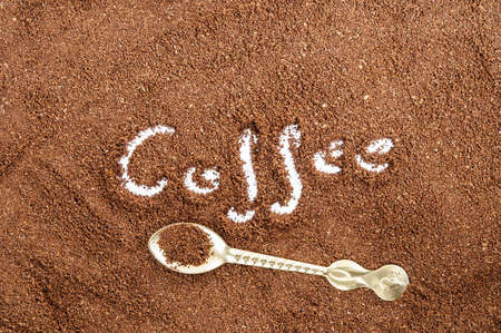 brown ground coffee whit spoon in itの写真素材