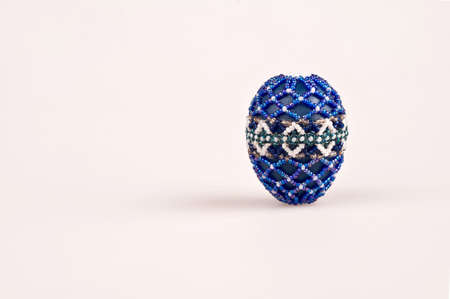 easter egg decorated with beadsの写真素材
