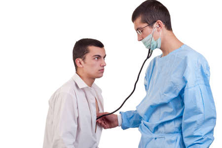 Doctor examine a young man patient with stethoscopeの写真素材