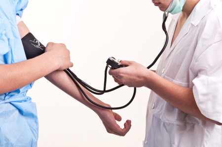 Doctor is measuring blood pressure with a tonometer