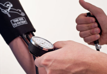 Patient is being observed by doctor - measuring blood pressure