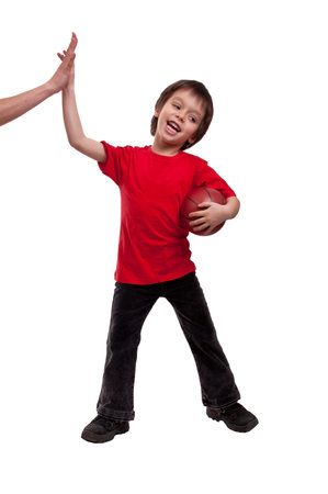 Child and mother giving a High Five after playing bascketball over white background