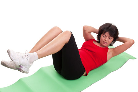 Young woman doing exercise for abs isolated on white background