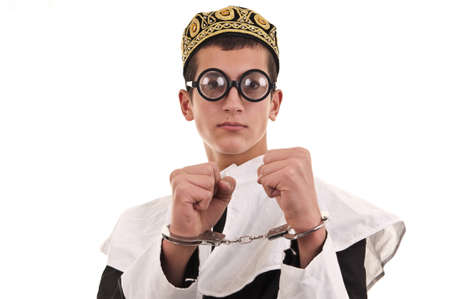 young man with handcuffs costumed in nun for fun, funny religious conceptの写真素材
