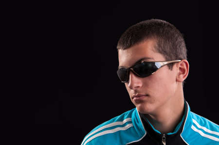 Portrait of trendy young male wearing sunglassesの写真素材