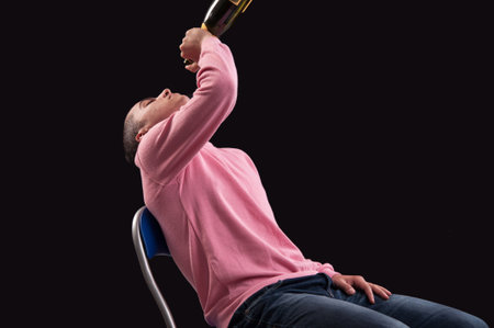 Young man drinking alcohol